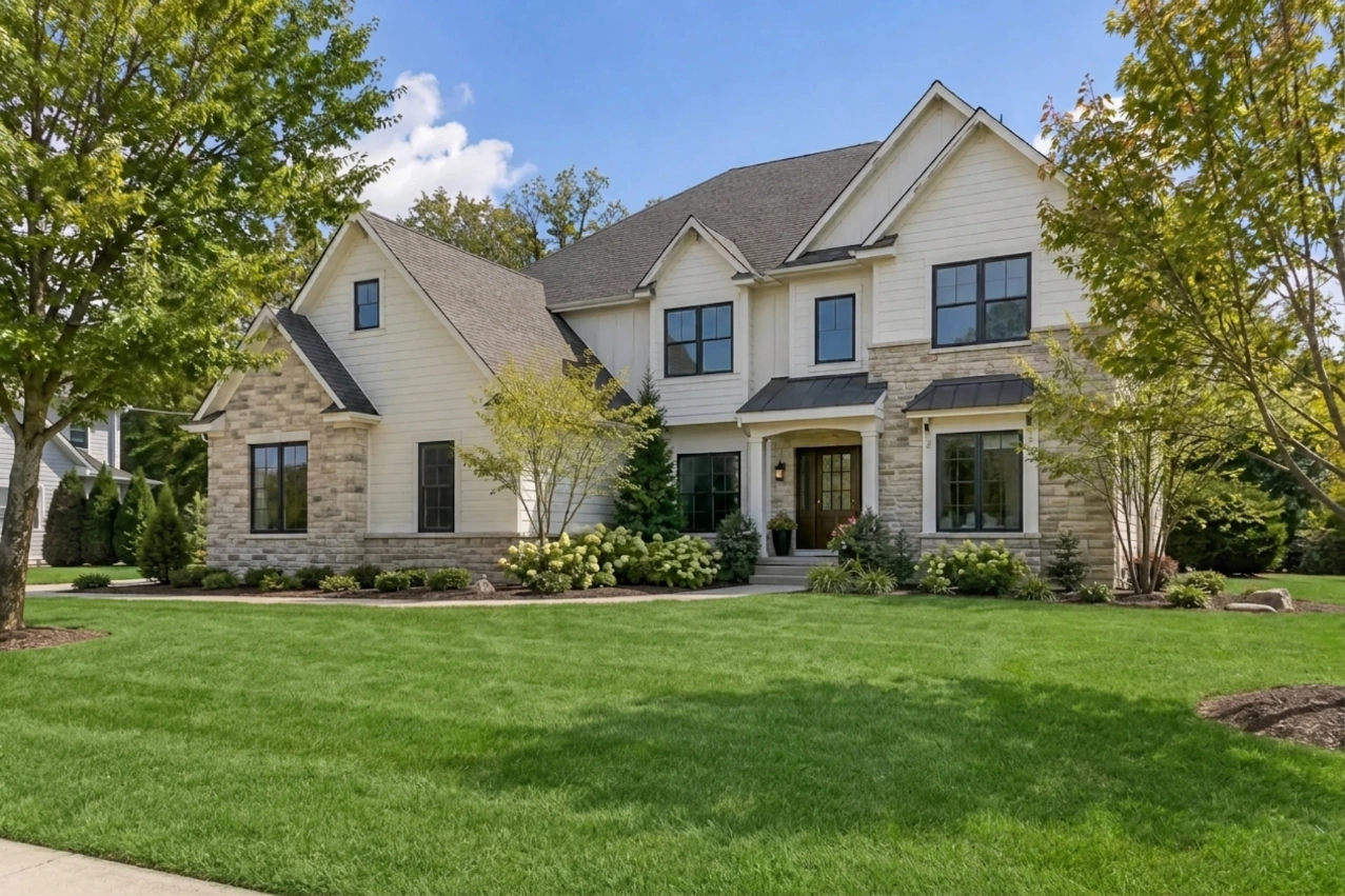 The house with a greener lawn replacing the patchy grass